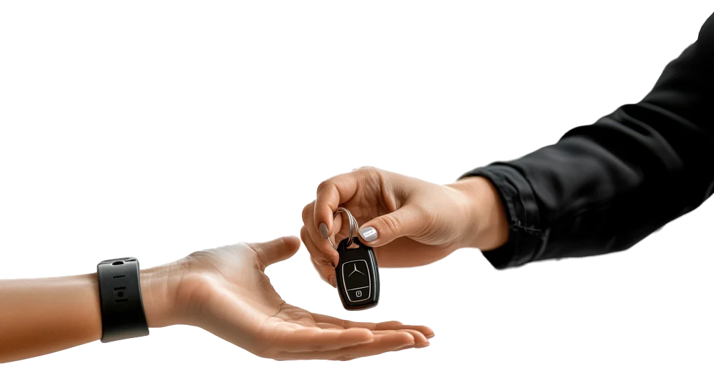 Hand passing a car key with remote to an open hand, car rental in Calahonda
